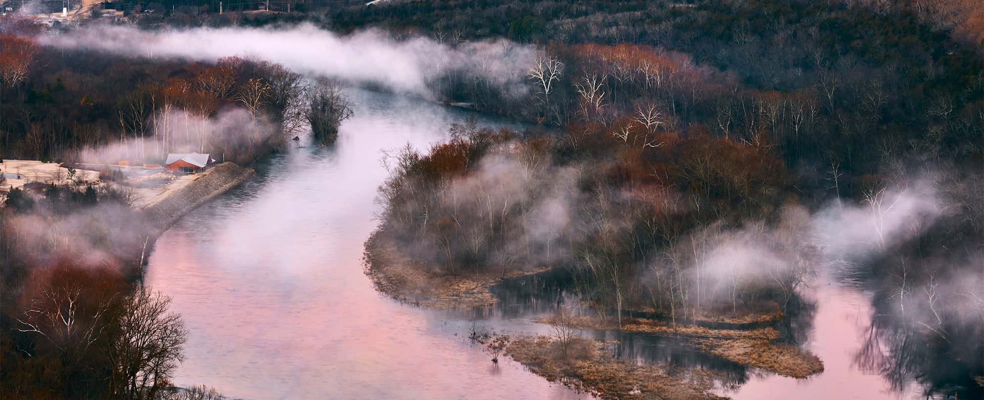 Lake Tanycomo covered in fog at the Lakeside Forest Wilderness Area.