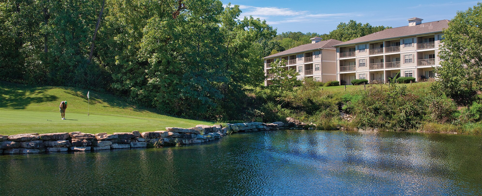 A man plays on a waterfront golf course at WorldMark Branson, a timeshare resort in Branson, Missouri. 