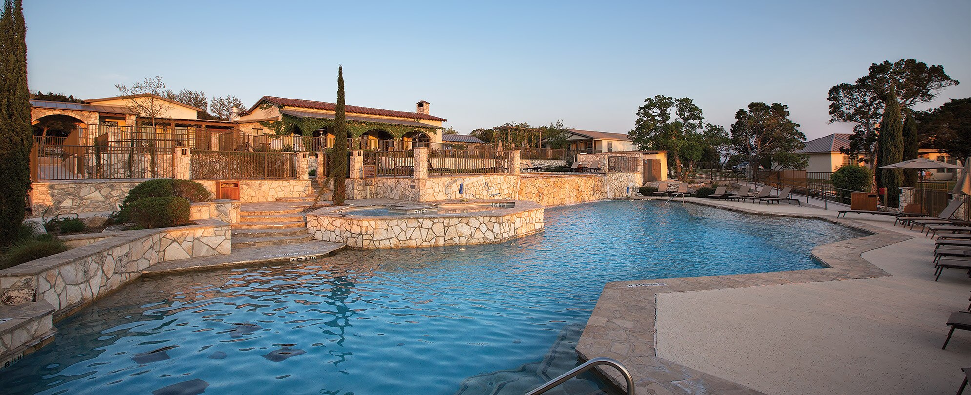 The outdoor pool and hot tub at WorldMark Stablewood Springs, a timeshare resort in Hunt, Texas.