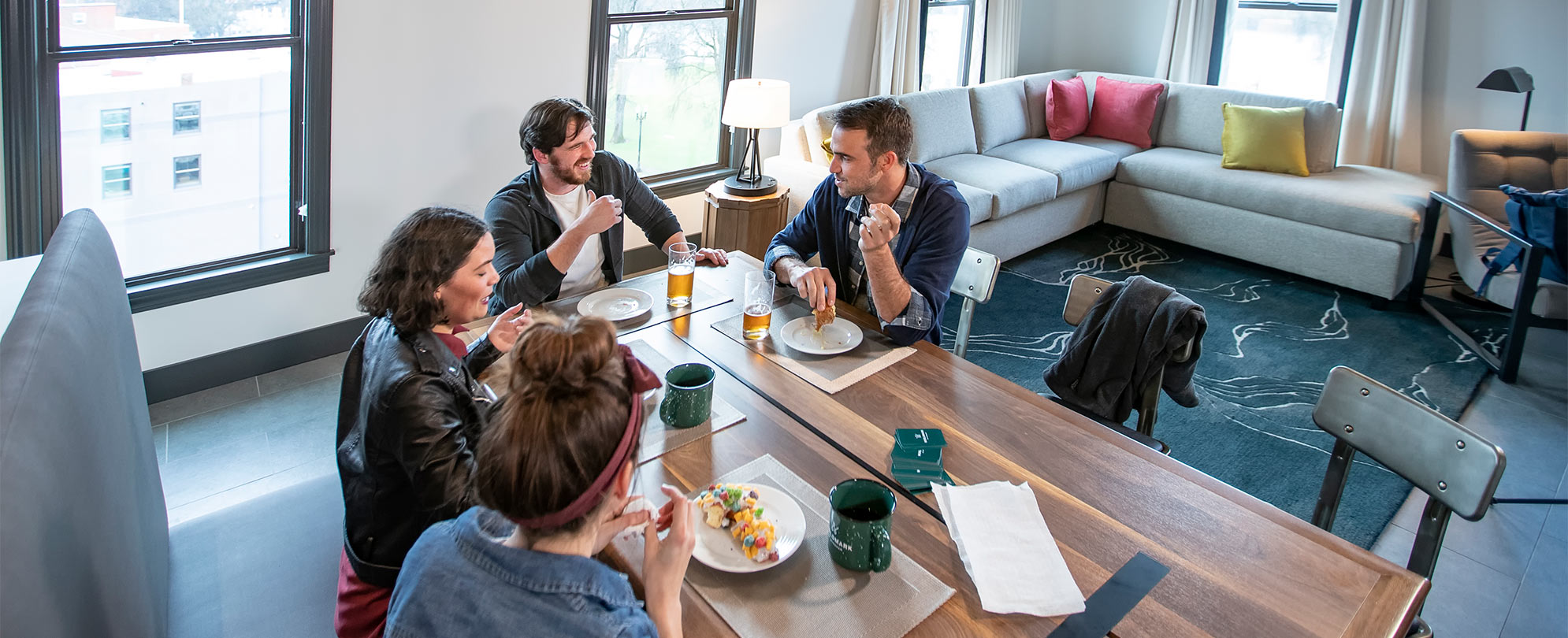 Friends enjoying a meal at their suite dining table at a WorldMark resort.